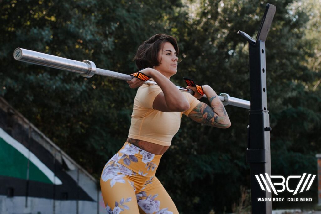 Woman Weightlifting Using WBCM Straps